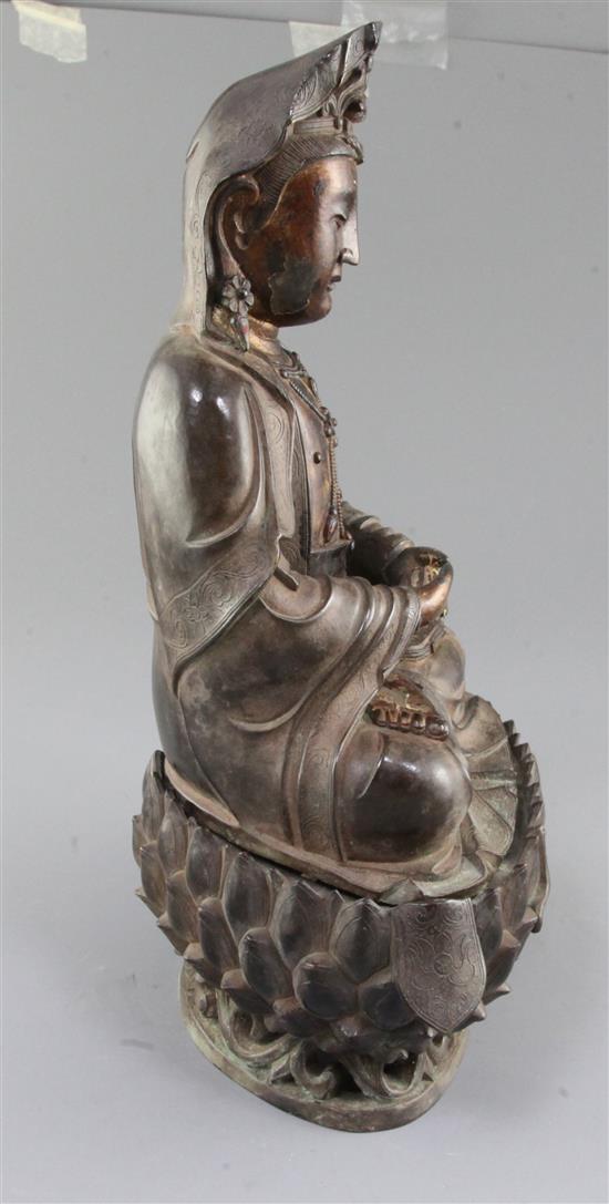 A large Chinese lacquered bronze seated figure of Guanyin, height 35cm